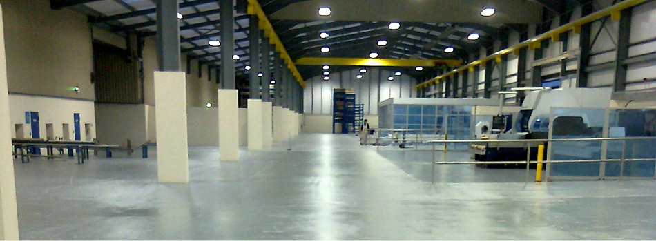 Industrial floor painting in Dairymaster warehouse at Causeway Co. Kerry Ireland  by Total Paintworks Ltd.