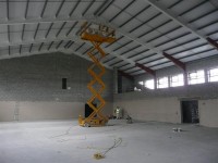 Painting of a warehouse using access equipment. Total Paintworks Ltd., Ireland